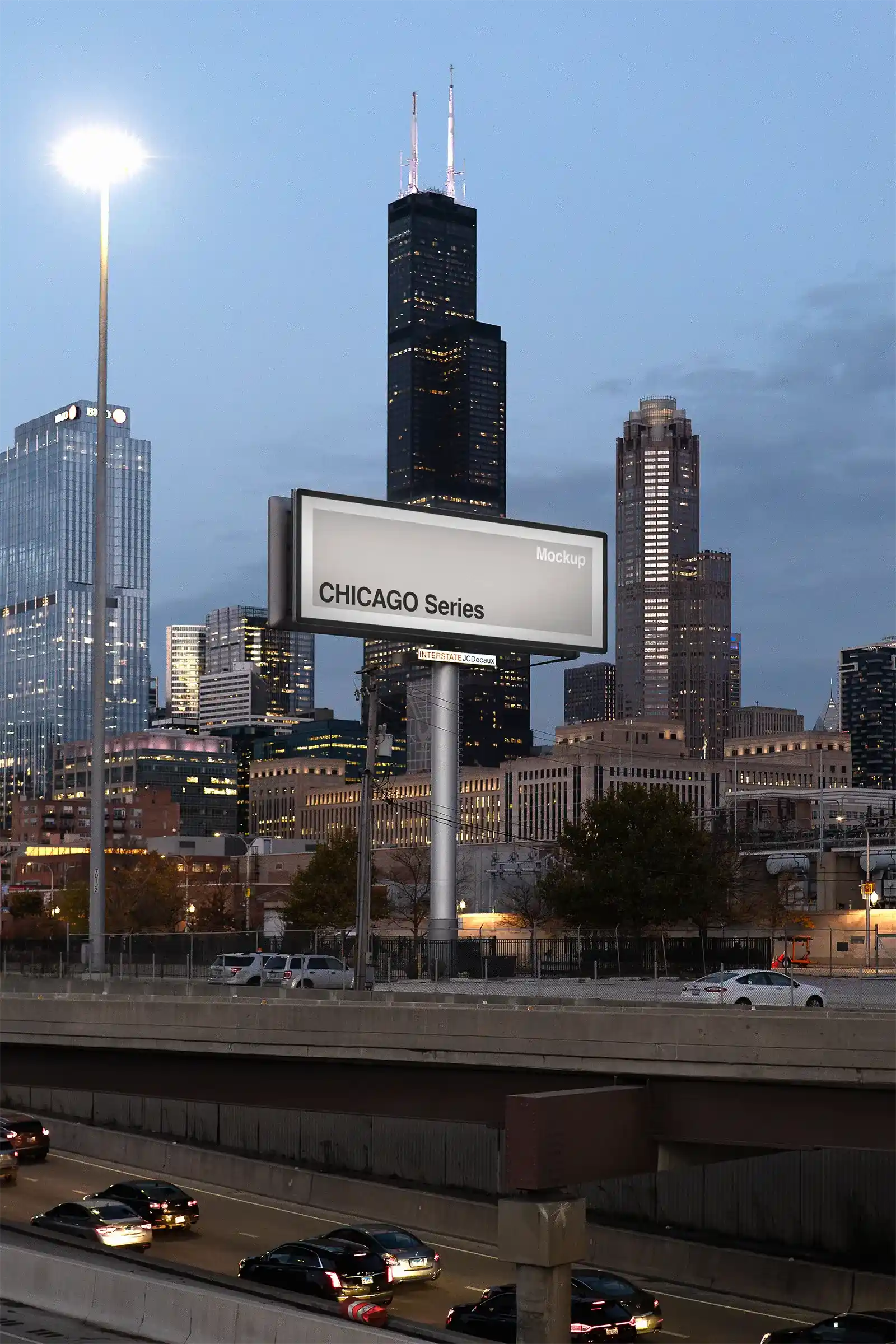 Billboard mockup by the highway in Chicago, United States, in fornt of the Sears Tower at dusk