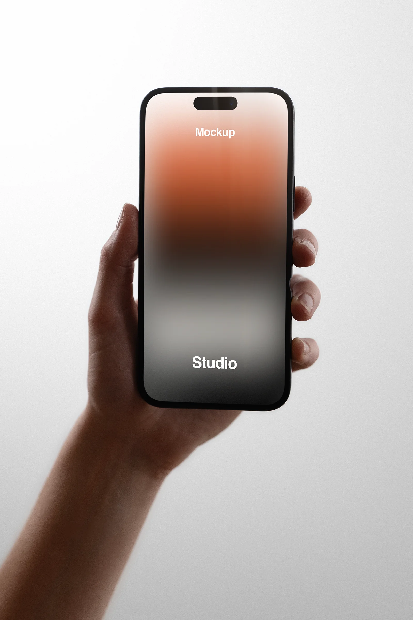Handheld iPhone Mockup in a photo studio in New York - BRANDACLE