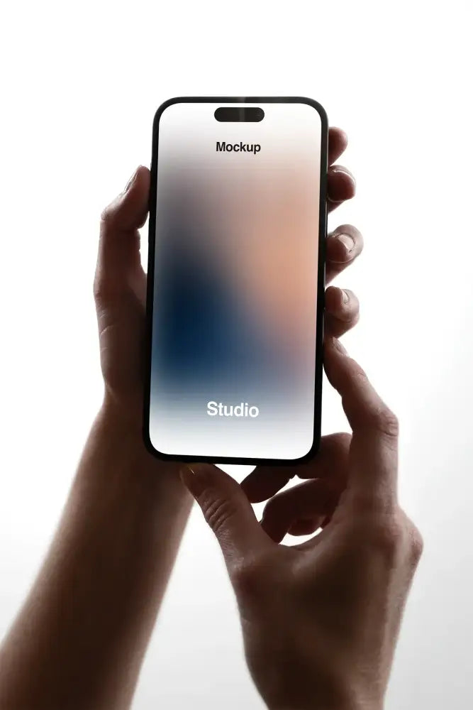 Handheld iPhone Mockup in a photo studio in New York - BRANDACLE