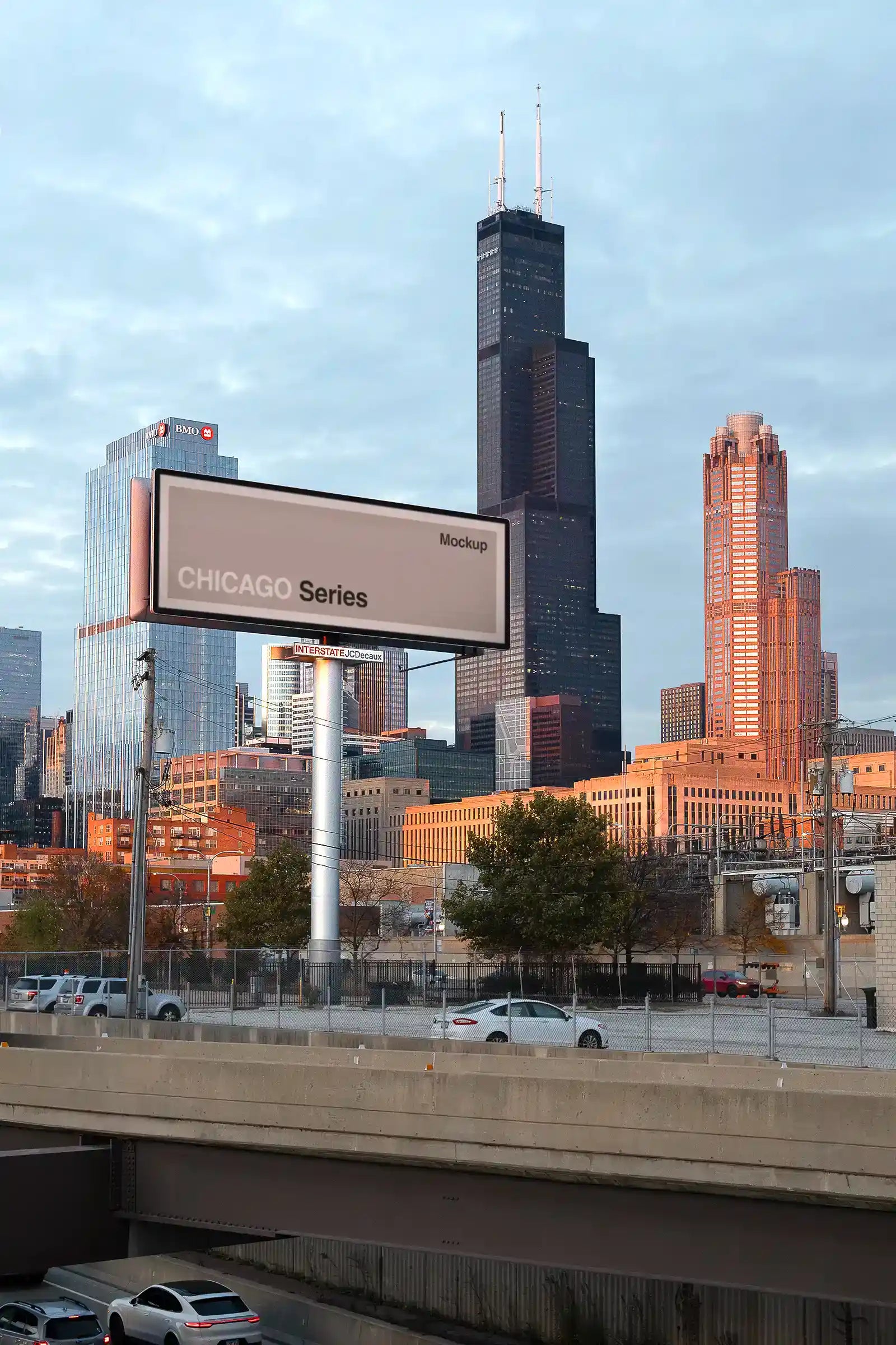 Billboard mockup by the highway in Chicago, United States, in front of the Sears Tower. 