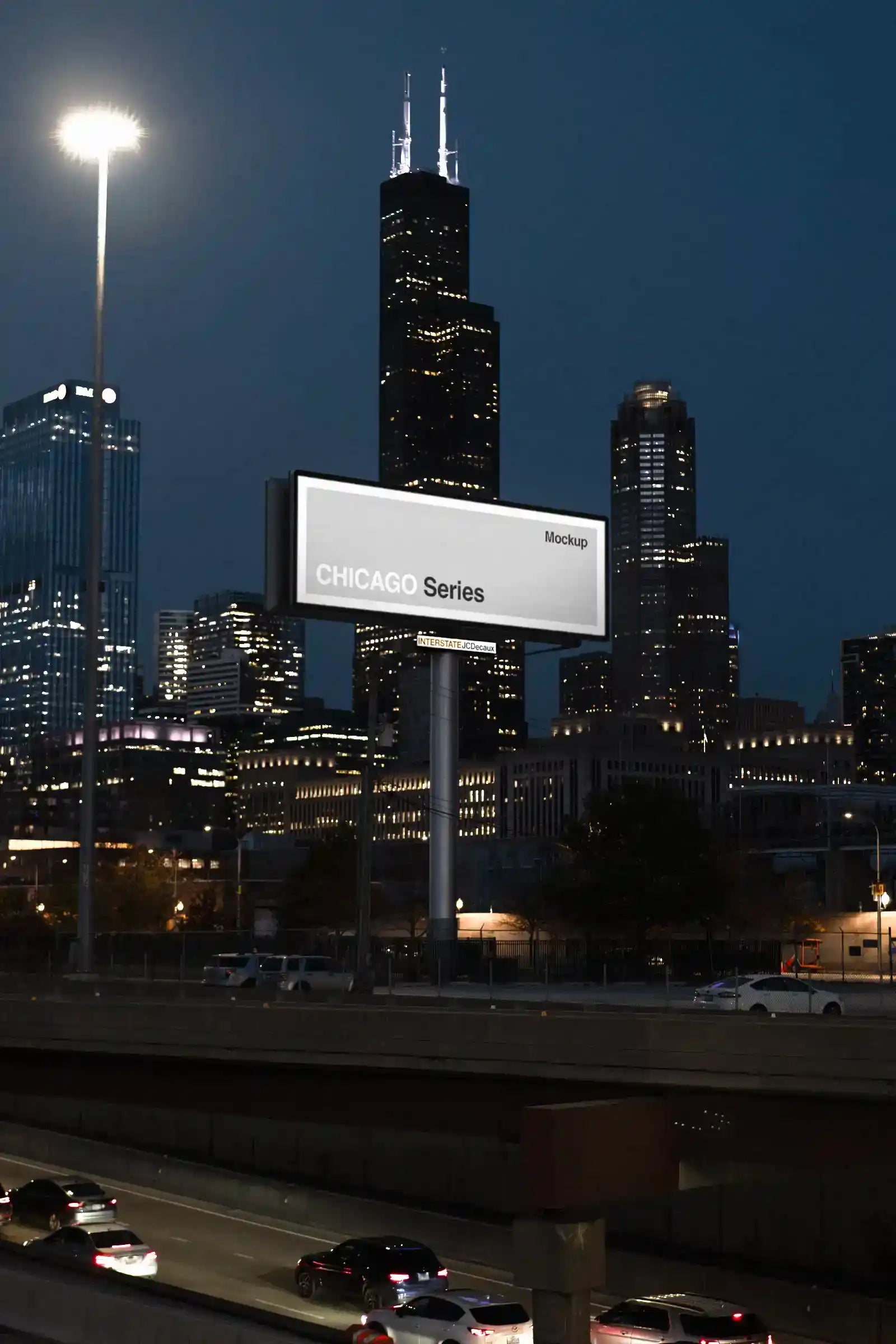 Billboard mockup by the highway in Chicago, United States, in fornt of the Sears Tower at night