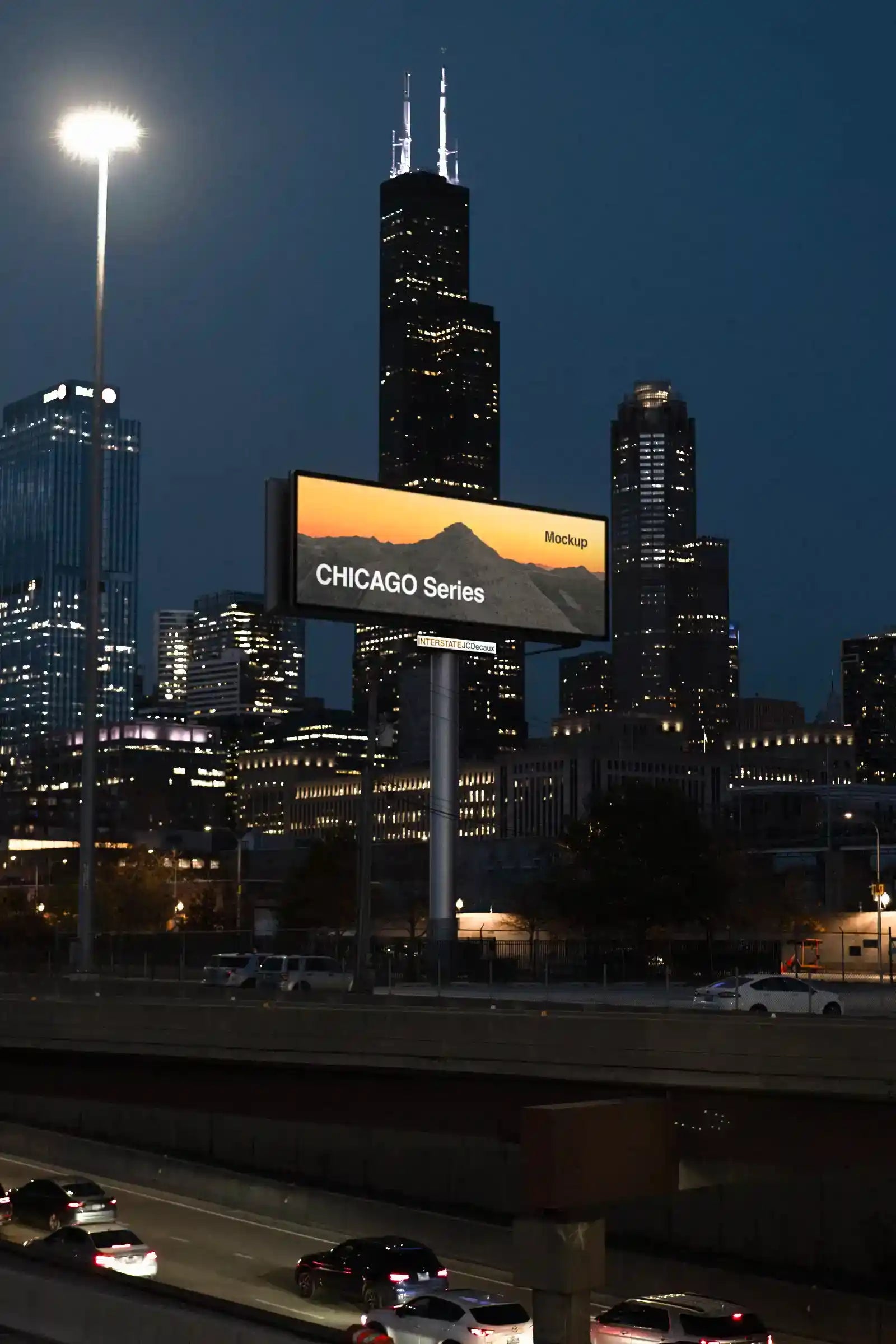 Billboard mockup by the highway in Chicago, United States, in fornt of the Sears Tower at night