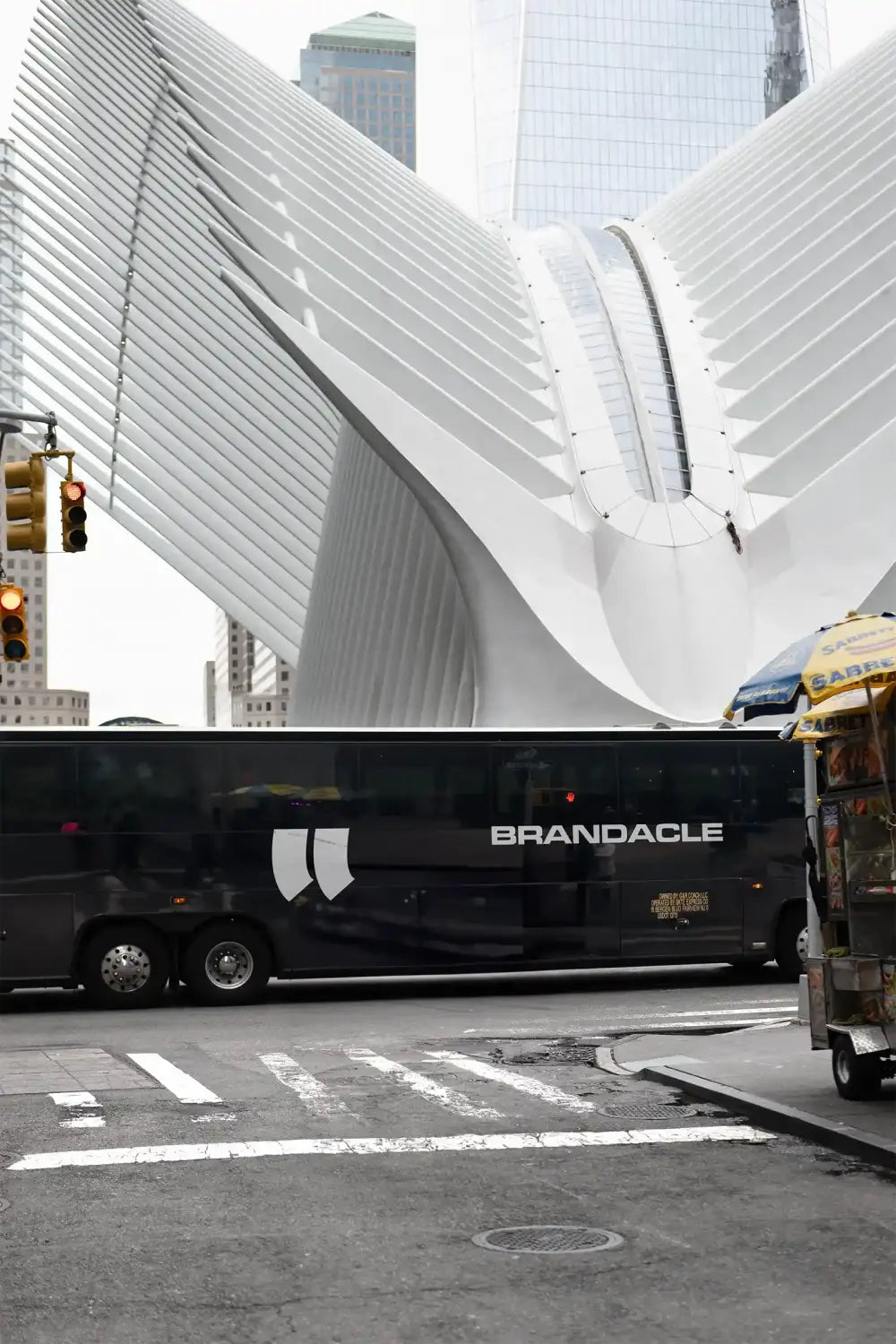 Bus mockup in Manhattan, New York. World Trade Center © BRANDACLE MOCKUPS 2026. 