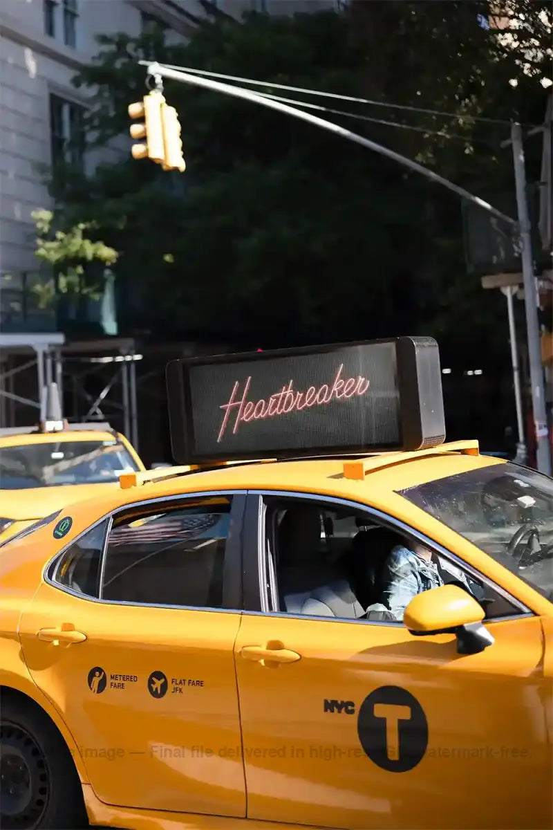 Taxi cab with a billboard mockup on top in New York, United States
