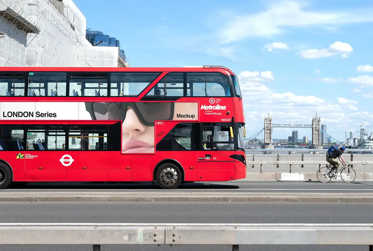 Red bus poster mockup against the backdrop of the iconic Tower Bridge in Central London