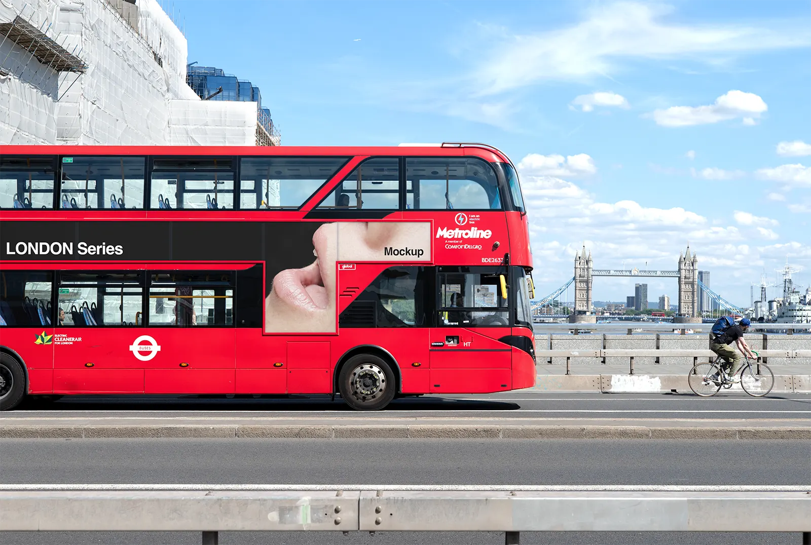 Red bus poster mockup against the backdrop of the iconic Tower Bridge in Central London © BRANDACLE MOCKUPS 2026.