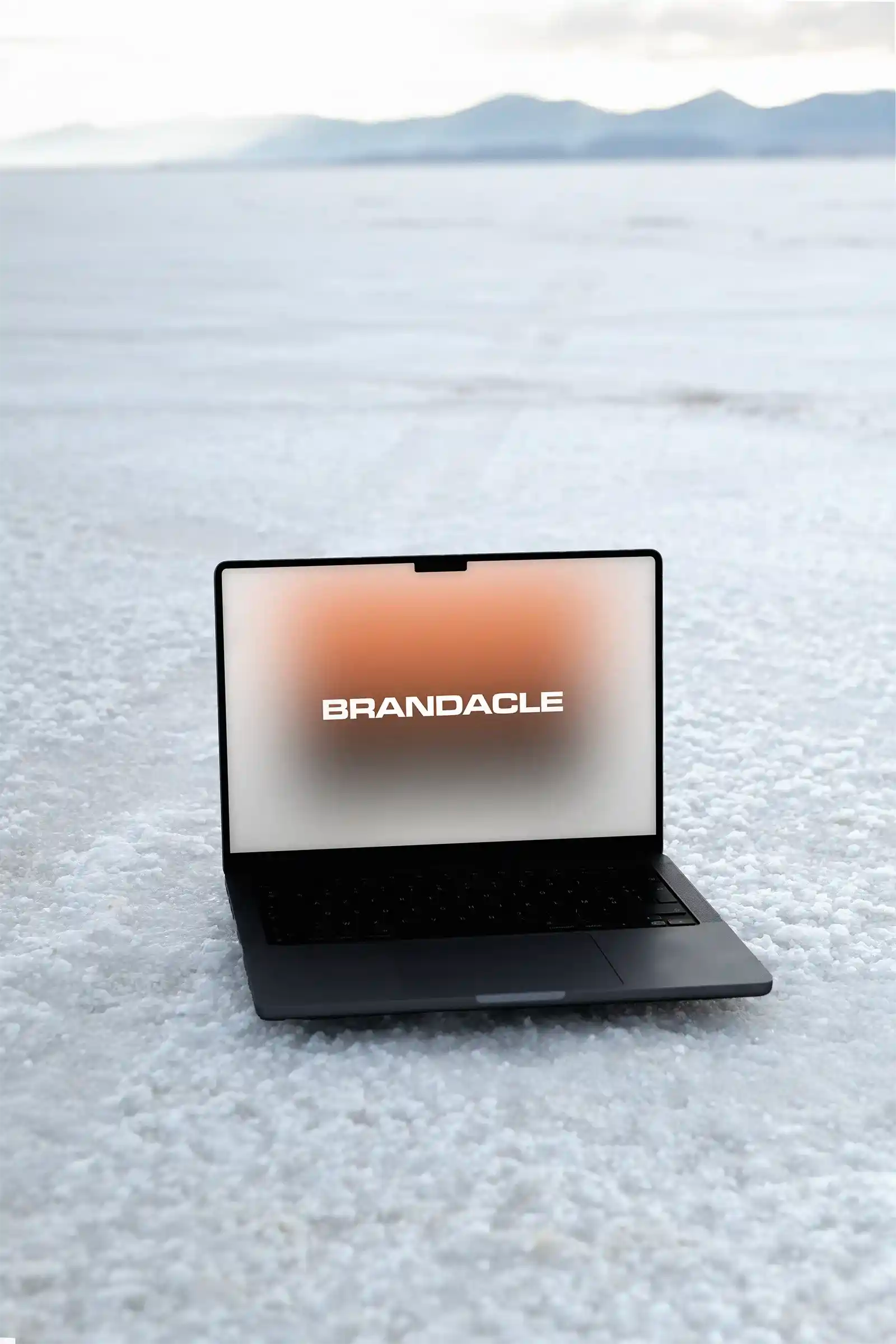 Laptop mockup in the Great Salt Lake desert in Utah, United States. MacBook PSD Mockup for Photoshop