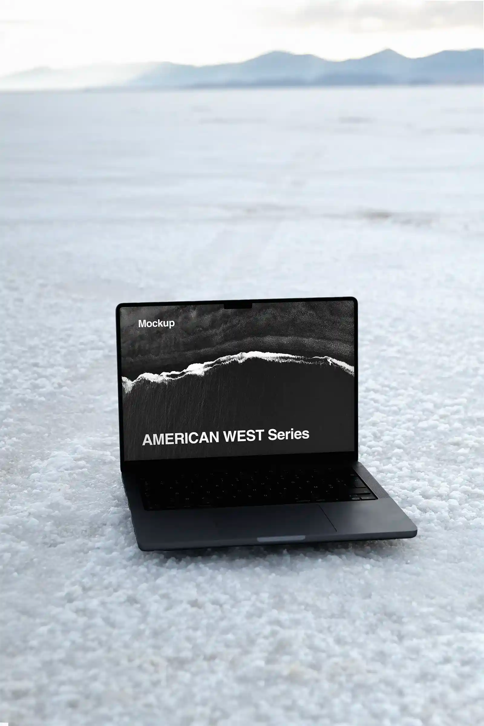Laptop mockup in the Great Salt Lake desert in Utah, United States. MacBook PSD Mockup for Photoshop